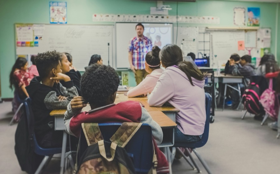 A teacher presenting a lesson to a classroom of students